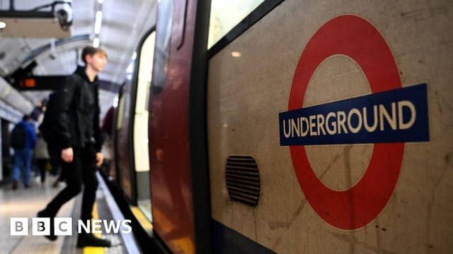 File image showing man boarding a Tube carriage