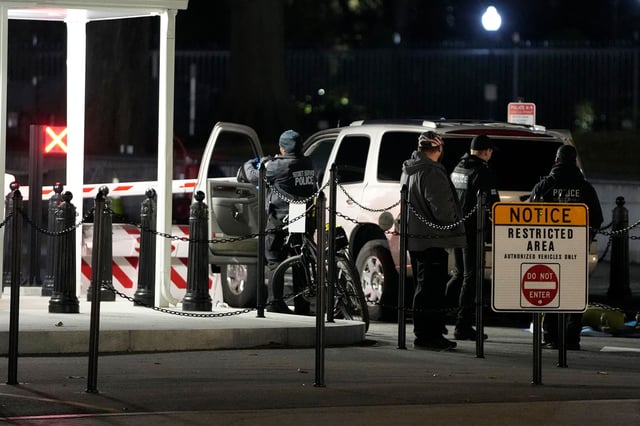 U.S. Secret Service police investigate near a vehicle that hit a security barrier at a entry point for the White House complex Monday, January 8, 2024, in Washington.