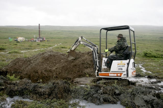 FILE – A worker with the Pebble Mine project digs in the Bristol Bay region of Alaska near the village of Iliamma, Alaska, July 13, 2007. Environmental Protection Agency Administrator Michael Regan said he fully supports his agency’s decision to block a proposed gold and copper mine in Alaska’s salmon-rich Bristol Bay in a telephone interview with The Associated Press on Tuesday, Aug. 29, 2023. (AP Photo/Al Grillo, File)
