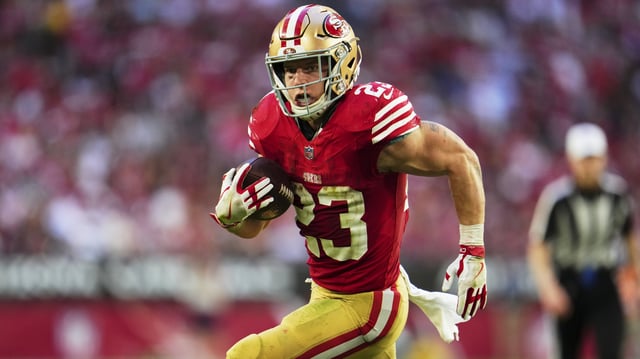 GLENDALE, AZ - DECEMBER 17: Christian McCaffrey #23 of the San Francisco 49ers carries the ball against the Arizona Cardinals at State Farm Stadium on December 17, 2023 in Glendale, Arizona.