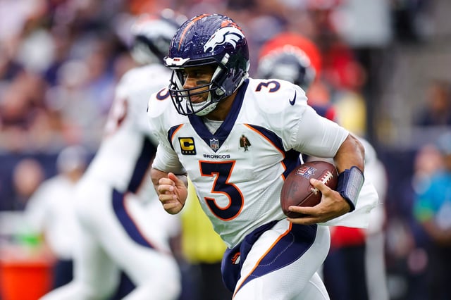 Russell Wilson runs with the ball in the fourth quarter of the Denver Broncos' game against the Houston Texans at NRG Stadium on December 3, 2023.