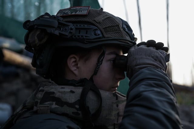 Ukraine soldier views Russian positions in Luhansk