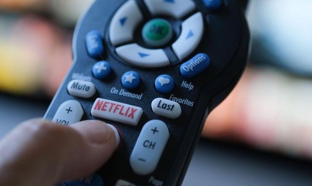 In this illustration photo taken on July 19, 2022 the Netflix logo is seen on a TV remote in Los Angeles.