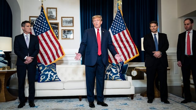 Former President Donald Trump flanked by attorney John Lauro, left, and D. John Sauer, center right, speaks to reporters and members of the media at the Waldorf Astoria hotel after attending a hearing of the D.C. Circuit Court of Appeals at the federal courthouse on Tuesday, Jan. 09, 2024, in Washington, DC. (Photo by Jabin Botsford/The Washington Post via Getty Images)