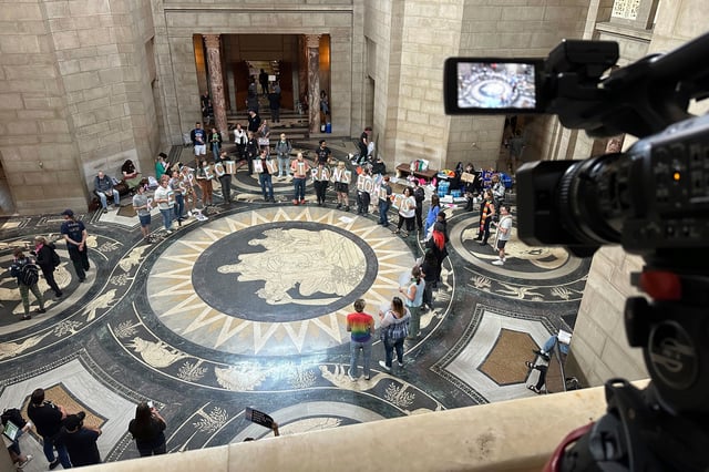 Protesters gather inside the State Capitol building on May 19, 2023, in Lincoln, Neb.