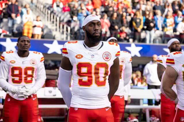 INGLEWOOD, CALIFORNIA - JANUARY 07: Charles Omenihu #90 of the Kansas City Chiefs looks on during the national anthem prior to an NFL football game between the Los Angeles Chargers and the Kansas City Chiefs at SoFi Stadium on January 07, 2024 in Inglewood, California.