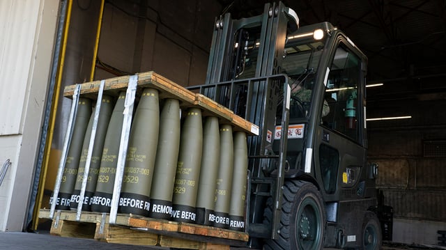 FILE – Airmen with the 436th Aerial Port Squadron use a forklift to move 155 mm shells ultimately bound for Ukraine, April 29, 2022, at Dover Air Force Base, Del. Officials say the U.S. will send Ukraine about $500 million in ammunition and equipment and will spend more than $2 billion to buy an array of munitions, radar and other weapons in the future. (AP Photo/Alex Brandon)