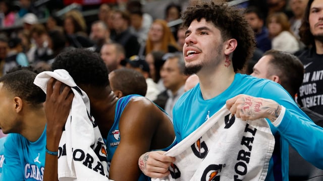 SAN ANTONIO, TX - JANUARY 12: LaMelo Ball #1 of the Charlotte Hornets cheers on his team against the San Antonio Spurs in the first half at Frost Bank Center on January 12, 2024 in San Antonio, Texas. NOTE TO USER: User expressly acknowledges and agrees that, by downloading and or using this photograph, User is consenting to terms and conditions of the Getty Images License Agreement. (Photo by Ronald Cortes/Getty Images)