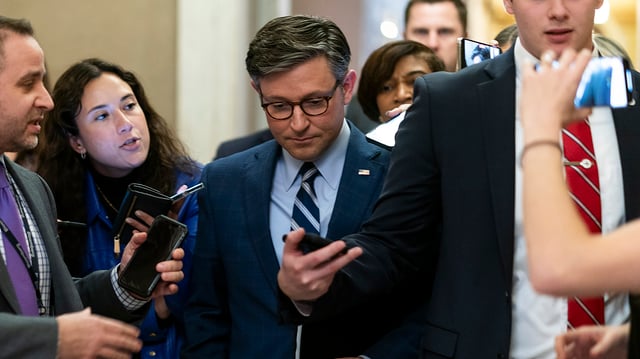 Speaker Mike Johnson (R-La.) addresses reporters as he returns to his office from a series of procedural votes and meetings to discuss funding the government on Thursday, January 11, 2024.