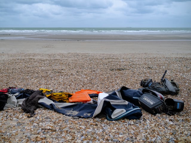 WIMEREUX, HAUTS-DE-FRANCE, FRANCE - NOVEMBER 26: Personal belongings of people who attempted the cross the English Channel lay on the beach on November 26, 2021 in Willemeux, Pas-de-Calais, France. After the boat accident in the English Channel which claimed at least 27 lives, the dispute between London and Paris over measures to curb illegal migration threatens to escalate. (Photo by Thierry Monasse/Getty Images)