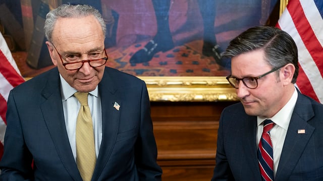 Majority Leader Chuck Schumer (D-N.Y.) and Speaker Mike Johnson (R-La.) are seen following a Menorah lighting ceremony at the Capitol in Washington, D.C., on Tuesday, December 12, 2023.