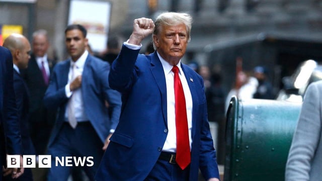 Former US President Donald Trump departs after speaking to the press after attending the civil fraud trial against the Trump Organization in New York State Supreme Court, in New York City on January 11, 2024