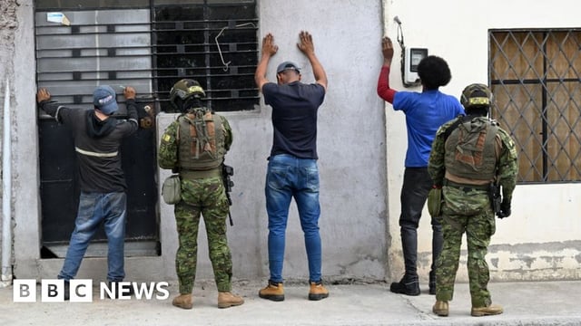 Members of the Army's Elite Forces frisk men and check their identities during a patrol in the streets of Moran, a neighbourhood in northern Quito, on 11 January 2024