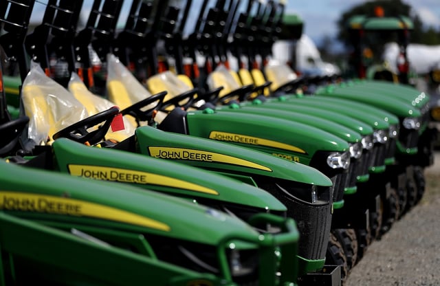 John Deere tractors in a line
