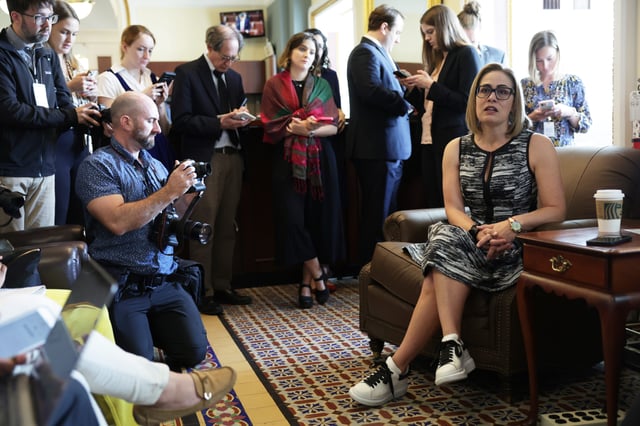 Sen. Kyrsten Sinema speaks to reporters