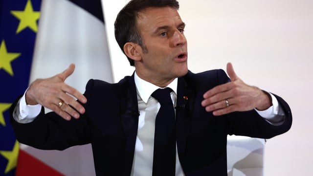 French President Emmanuel Macron answers a question during his first prime-time news conference to announce his top priorities for the year as he seeks to revitalize his presidency, vowing to focus on "results" despite not having a majority in parliament, Tuesday, Jan. 16, 2024 at the Elysee Palace in Paris. (AP Photo/Aurelien Morissard)