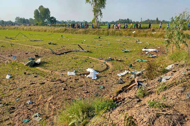 Debris in a field after an explosion at a fireworks factory near Sala Khao township in Thailand’s Suphan Buri province. Photo: Anuwat Shoprom/Handout/AFP