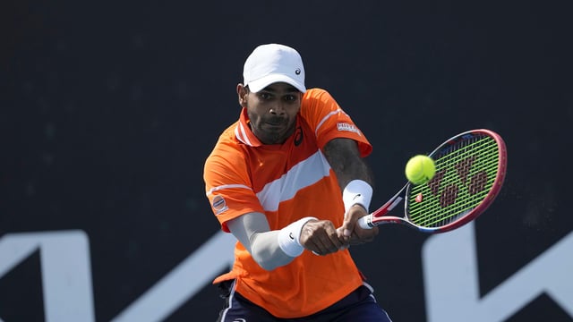 Nagal plays a backhand during his landmark win against Alexander Bublik.