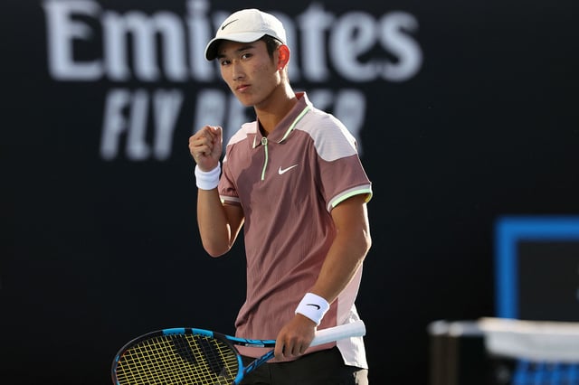 Shang celebrates during his Australian Open win against Mackenzie McDonald.