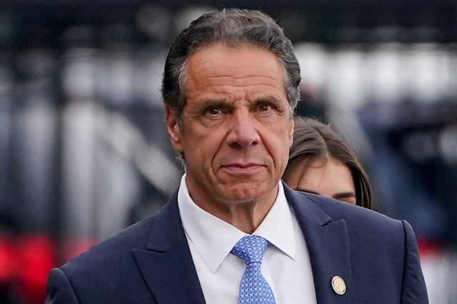 FILE - Then-New York Gov. Andrew Cuomo prepares to board a helicopter after announcing his resignation, Aug. 10, 2021, in New York. When New York's Adult Survivors Act expired on Friday, Nov. 24, 2023, more than 3,700 legal claims had been filed, with many of the last few coming against big-name celebrities and a handful of politicians, such as Cuomo. (AP Photo/Seth Wenig, File)