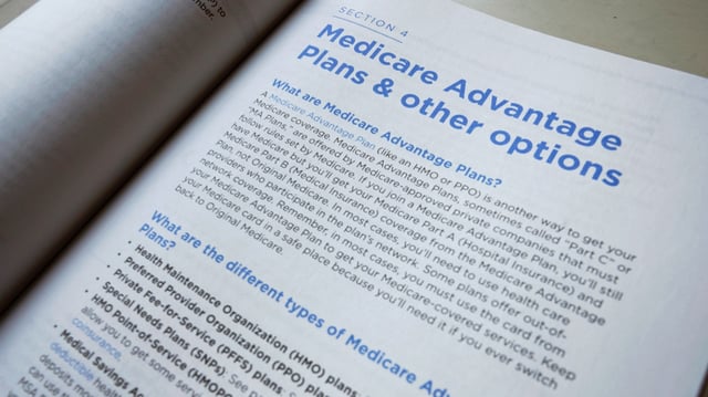 This Nov. 8, 2018 file photo shows a page from the 2019 U.S. Medicare Handbook in Washington. (AP Photo/Pablo Martinez Monsivais, File)