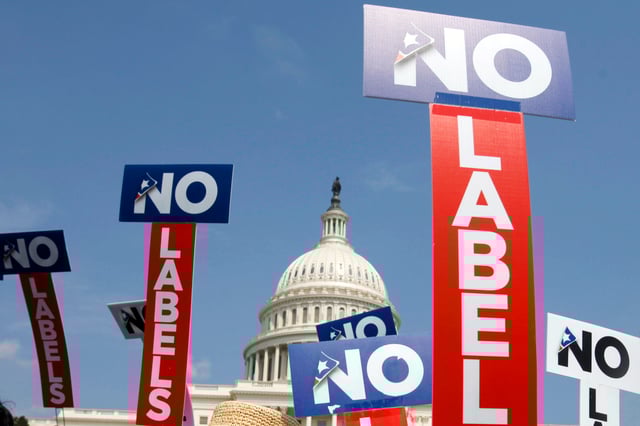 People with the group No Labels hold signs during a rally on Capitol Hill in Washington, July 18, 2011. More than 15,000 people in Arizona have registered to join a new political party floating a possible bipartisan âunity ticketâ against Joe Biden and Donald Trump.