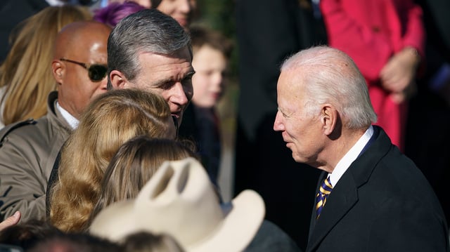 North Carolina Governor Roy Cooper (D) and his wife Kristin greet President Biden as he arrives for the annual turkey pardoning at a ceremony on the South Lawn of the White House in Washington, D.C., on Monday, November 21, 2022.