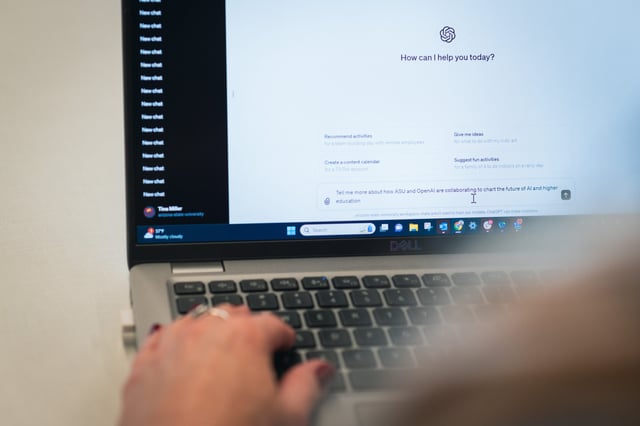 A person types a prompt into ChatGPT, generative artificial intelligence system.