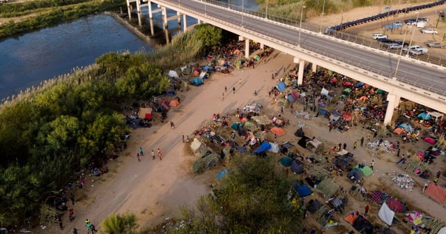 Illegal Immigrants, many from Haiti, are seen at an encampment along the Del Rio International Bridge near the Rio Grande in Del Rio, Texas, on Sept. 21, 2021. (Julio Cortez - File / AP)