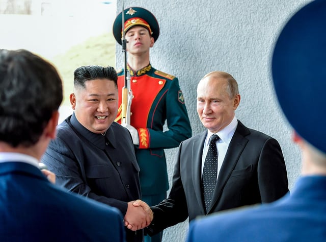 Russian President Vladimir Putin and North Korean leader Kim Jong Un shake hands during their meeting in Vladivostok, Russia, on April 25, 2019.