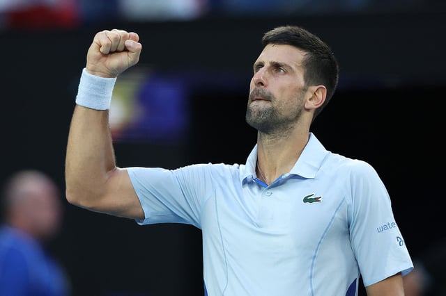 Djokovic celebrates winning match point against Fritz.