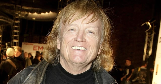 Frank Farian smiling wearing a jacket and t-shirt