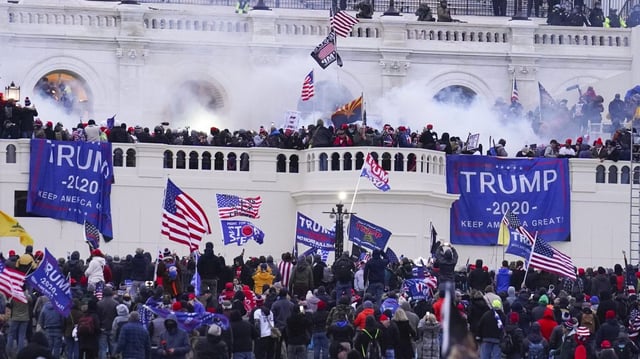 FILE – Rioters at the U.S. Capitol on Jan. 6, 2021, in Washington. Daniel “D.J.” Rodriguez, a California man who drove a stun gun into a police officer’s neck during one of the most violent clashes of the U.S. Capitol riot was sentenced on Wednesday to more than 12 years in prison. Rodriguez yelled, “Trump won!” as he was led out of the courtroom where U.S. District Judge Amy Berman Jackson sentenced him to 12 years and seven months behind bars for his role in the Jan. 6, 2021, attack. (AP Photo/John Minchillo, File)