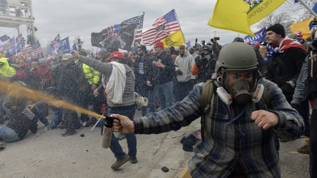 Trump supporters clash with police and security forces as people try to storm the US Capitol Building in Washington, DC, on January 6, 2021. – Demonstrators breeched security and entered the Capitol as Congress debated the a 2020 presidential election Electoral Vote Certification. (Photo by Joseph Prezioso / AFP) (Photo by JOSEPH PREZIOSO/AFP via Getty Images)