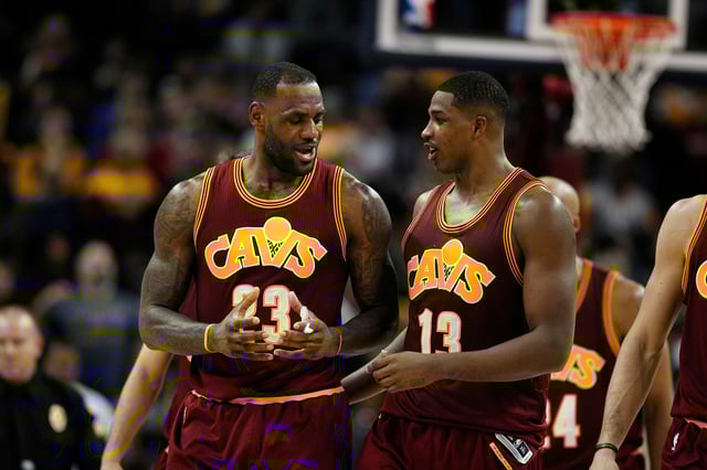 Thompson, pictured here alongside James in 2015, played a key role in Cleveland's title-winning team.