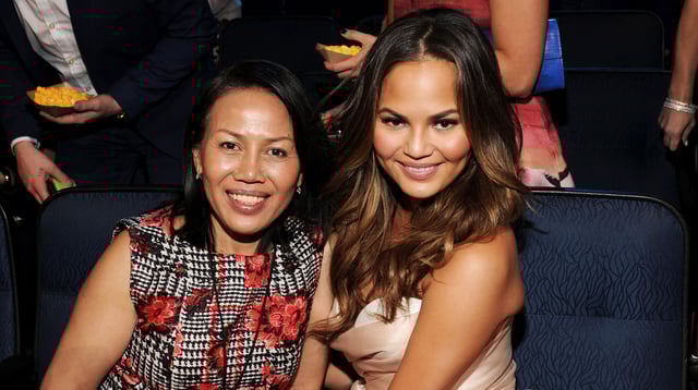 Chrissy Teigen (R) and Vilailuck Teigen attend the 2014 MTV Movie Awards at Nokia Theatre L.A. Live on April 13, 2014 in Los Angeles, California.