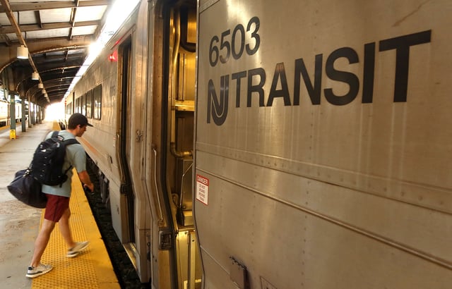 A person boards a NJ Transit train at the Hoboken Transit Terminal on September 1, 2023, in Hoboken, New Jersey.