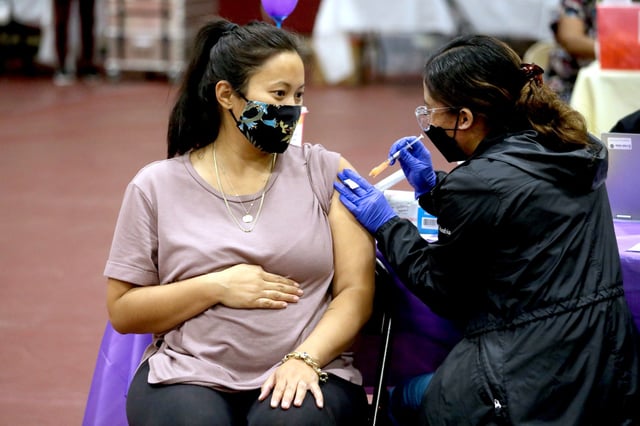 Nicole Fahey receives a Pfizer vaccination booster shot in Los Angeles, on Nov. 3, 2021. 