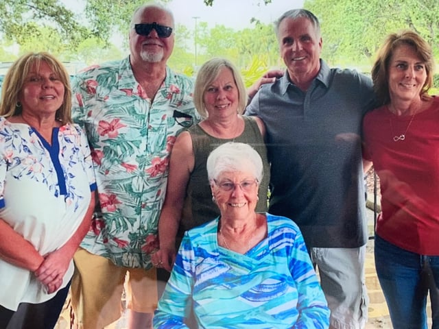 Gloria Serge, center, with family members.