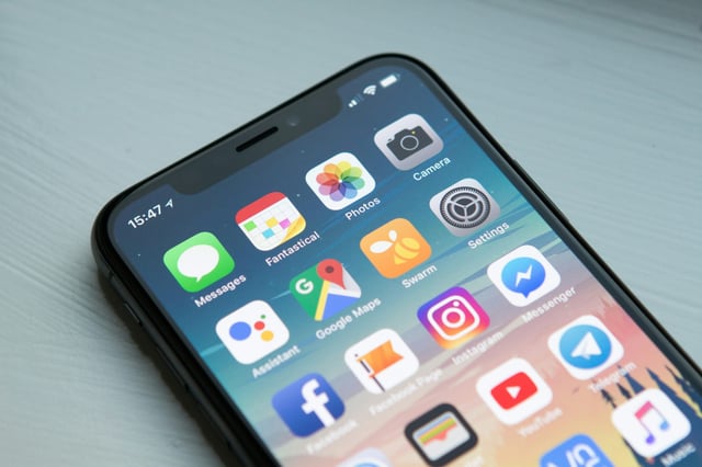 unlocked iphone with apps on display