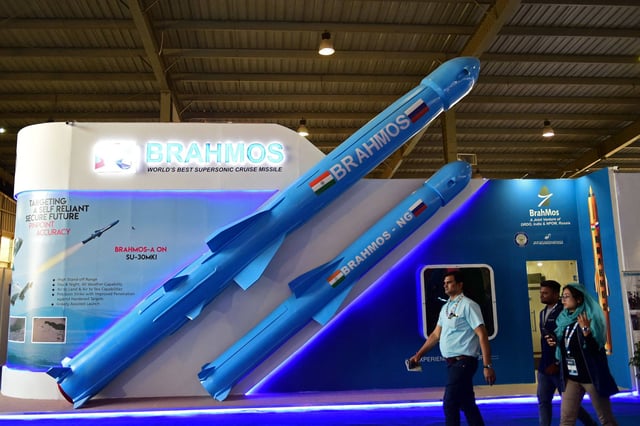 Visitors walk past a model of India’s BrahMos supersonic cruise missile displayed at the Defence Expo 2022 in Gandhinagar in October 2022. Photo: AFP