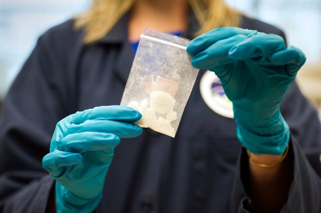 FILE – A bag of 4-fluoro isobutyryl fentanyl which was seized in a drug raid is displayed at the Drug Enforcement Administration (DEA) Special Testing and Research Laboratory in Sterling, Va., on Aug. 9, 2016. China on Friday, July 7, 2023, insisted it is up to the U.S. to “create necessary conditions” for anti-drugs cooperation, following complaints from Washington that Beijing has ignored its calls for a crackdown on precursor chemicals for the highly addictive painkiller fentanyl. (AP Photo/Cliff Owen, File)