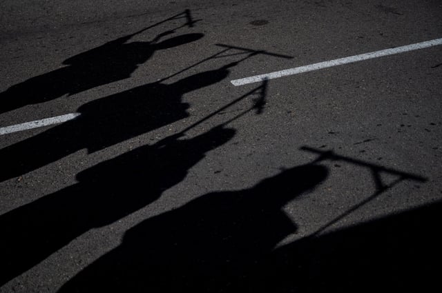 Silhouettes resemble hanged people during a protest against Iran’s executions and human rights violations in Madrid on Feb. 11, 2023.