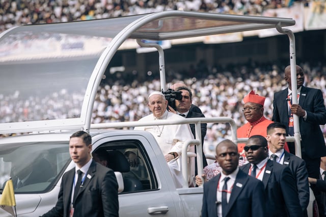 Pope Francis (C)arrives by popemobile for a meeting with young people and catechists at Martyrs' Stadium in Kinshasa, Democratic Republic of Congo (DRC), on February 2, 2023. - Pope Francis is set to address thousands of youngsters in Democratic Republic of Congo on February 2, 2023 after holding an open-air mass that drew an estimated million faithful, as he pursues a landmark trip to central Africa. (Photo by ALEXIS HUGUET / AFP) (Photo by ALEXIS HUGUET/AFP via Getty Images)