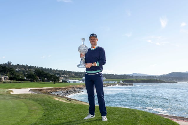 February 6, 2023; Pebble Beach, CA, USA; Justin Rose poses with the trophy on the 18th hole during the continuation of the final round of the AT&T Pebble Beach Pro-Am golf tournament at Pebble Beach Golf Links. Mandatory Credit: Kyle Terada-USA TODAY Sports