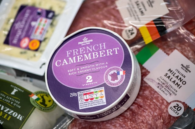 A French Camembert cheese sits with meat and cheese products from across Europe in a shopping basket inside a Morrisons supermarket, operated by Wm Morrison Supermarkets Plc, in this arranged photograph in London, U.K., on Wednesday, Aug. 8, 2018. Morrisons reported a growth in profits in their most recent financial year, boosted by food price inflation. Photographer: Chris J. Ratcliffe/Bloomberg via Getty Images