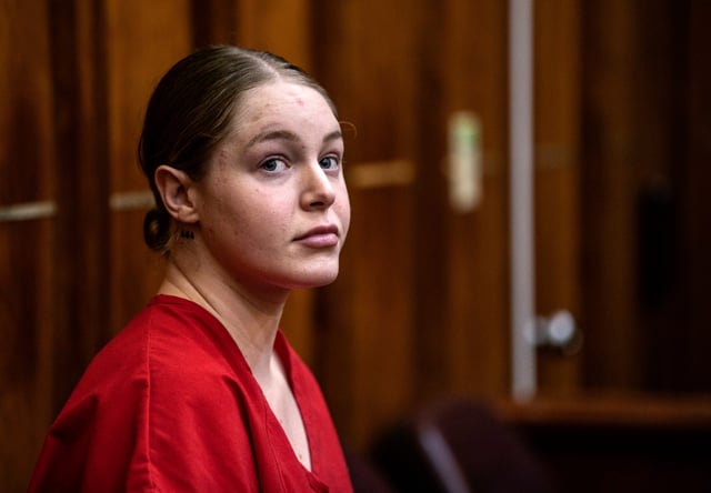 Social media model Courtney Clenney appears during a detention hearing, Tuesday Nov. 15, 2022, in Miami. Clenney, 26, is charged with murdering her boyfriend Christian Obumseli. (Pedro Portal/Miami Herald via AP, Pool)