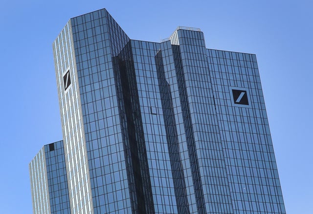 The headquarters of German bank Deutsche Bank with its logo are pictured in Frankfurt am Main, Germany on February 7, 2023. - Germany's Deutsche Bank on February 2 said it booked its highest annual profit since 2007 last year, thanks to higher interest rates and a major cost-cutting drive. The bank recorded a 5.03-billion-euro (USD 5.5 billion) net profit for 2022, up from 1.9 billion euros a year earlier. (Photo by Daniel ROLAND / AFP) (Photo by DANIEL ROLAND/AFP via Getty Images)