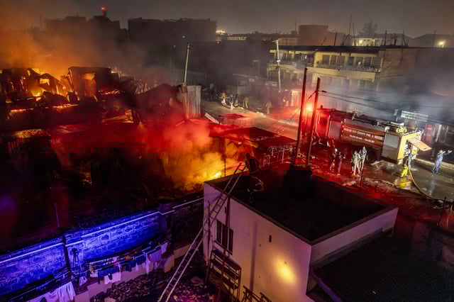 Firemen fight a blaze following a series of explosions in the Embakasi area of Nairobi, Kenya on February 2, 2024.