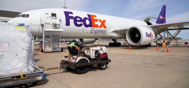 FedEx workers load a Boeing 777 full of medical supplies for Ukraine on Saturday, March 26, 2022, at the FedEx World Hub in Memphis. The plane will land in Warsaw, Poland, where 76 tons of medical supplies will be distributed to residents of Ukraine as well as refugees.